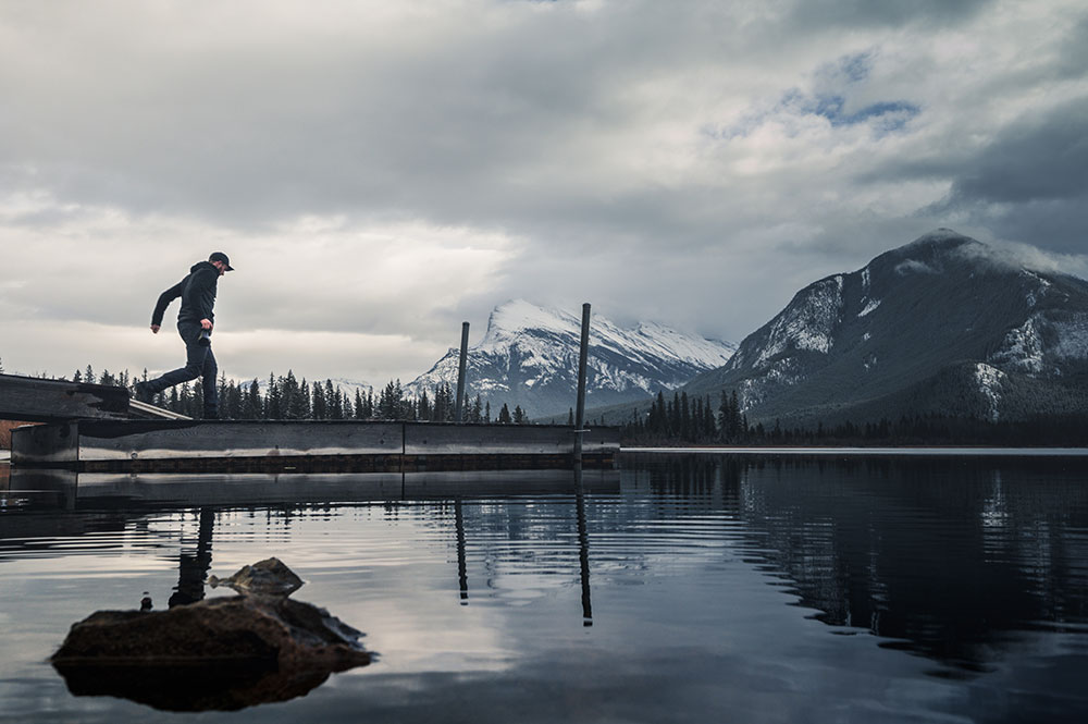 Anthony Riso walking with mountains in the background