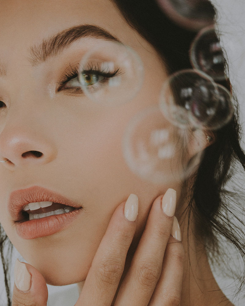 Marina Williams double exposure of a woman and bubbles close up