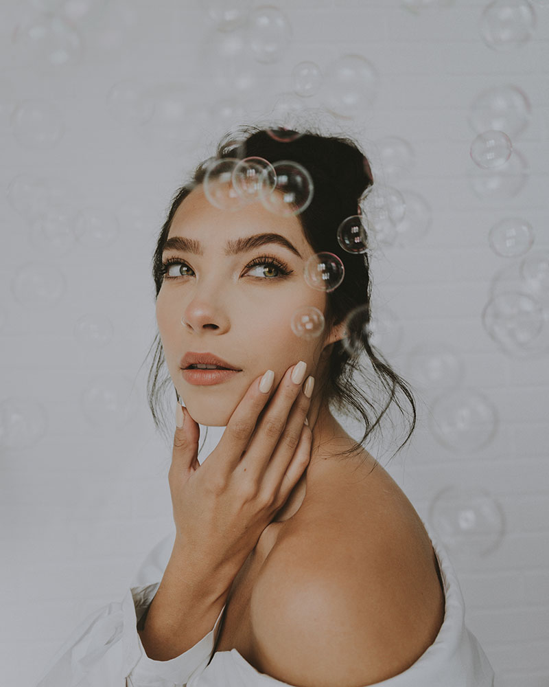 Marina Williams double exposure of a woman and bubbles