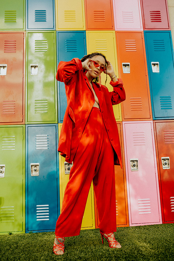 Cynthia Brown portrait of a model in front of a wall of lockers