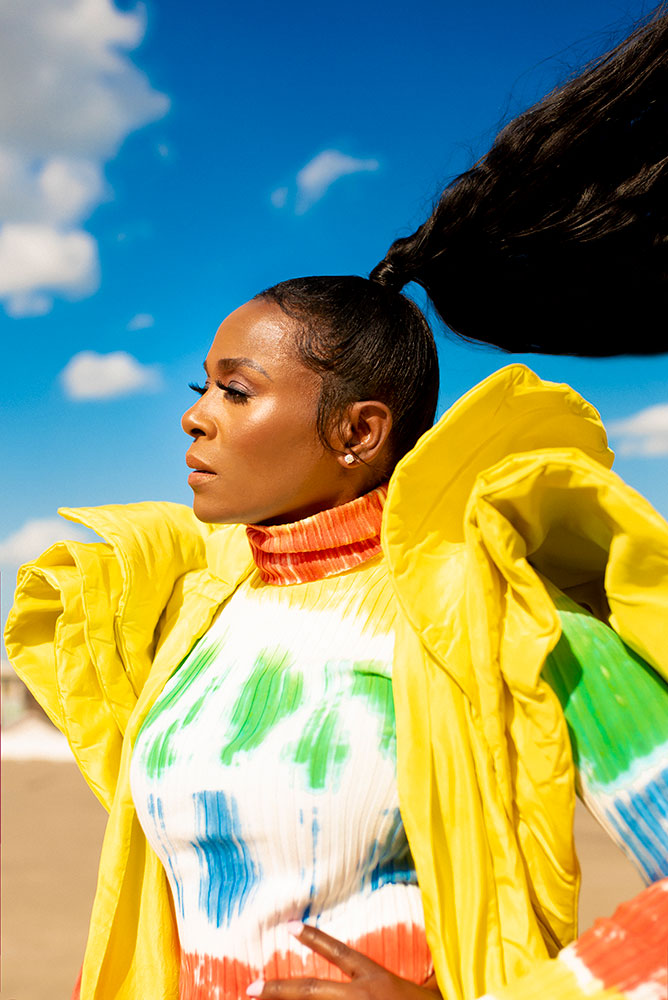 Cynthia Brown portrait of a model in bright colors with a huge ponytail