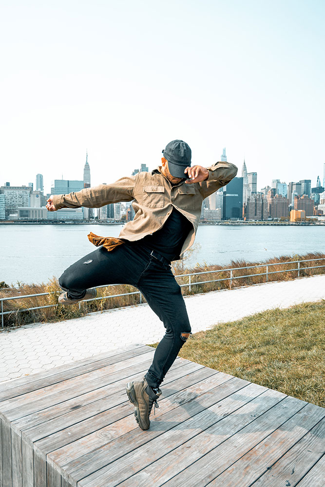 Jesus Presinal breakdancing near the waterfront in NYC