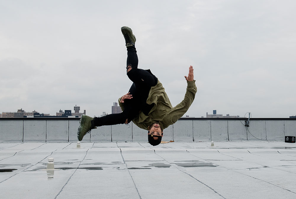 Jesus Presinal breakdancing upside down with the river in the background