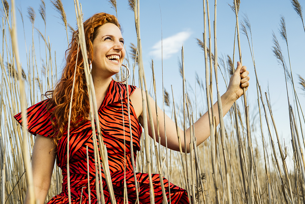 Gabriela Herman photo of a woman among marsh reeds
