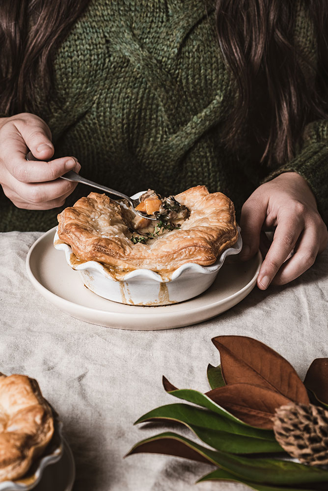 Bella Karragiannidis photo of a woman ready to eat a pot pie