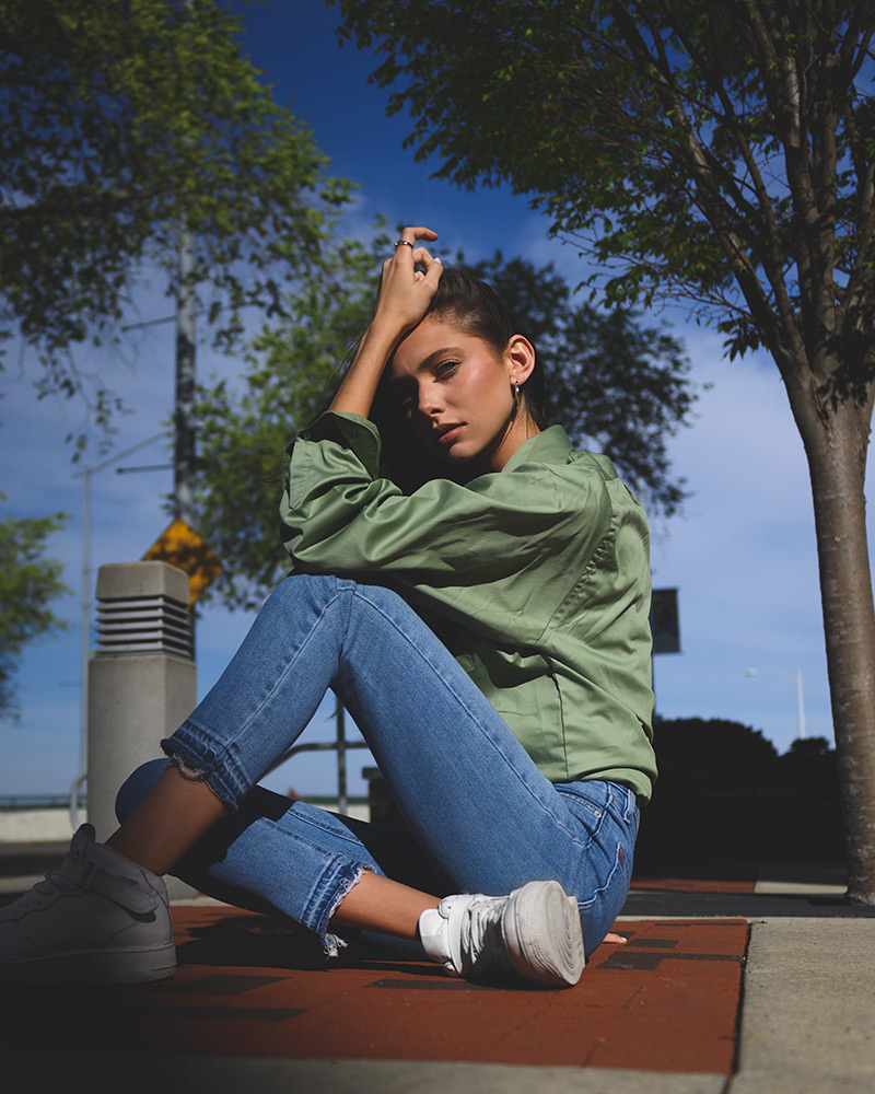 Bobby Kenny III photo of a girl in sunlight with trees in the background