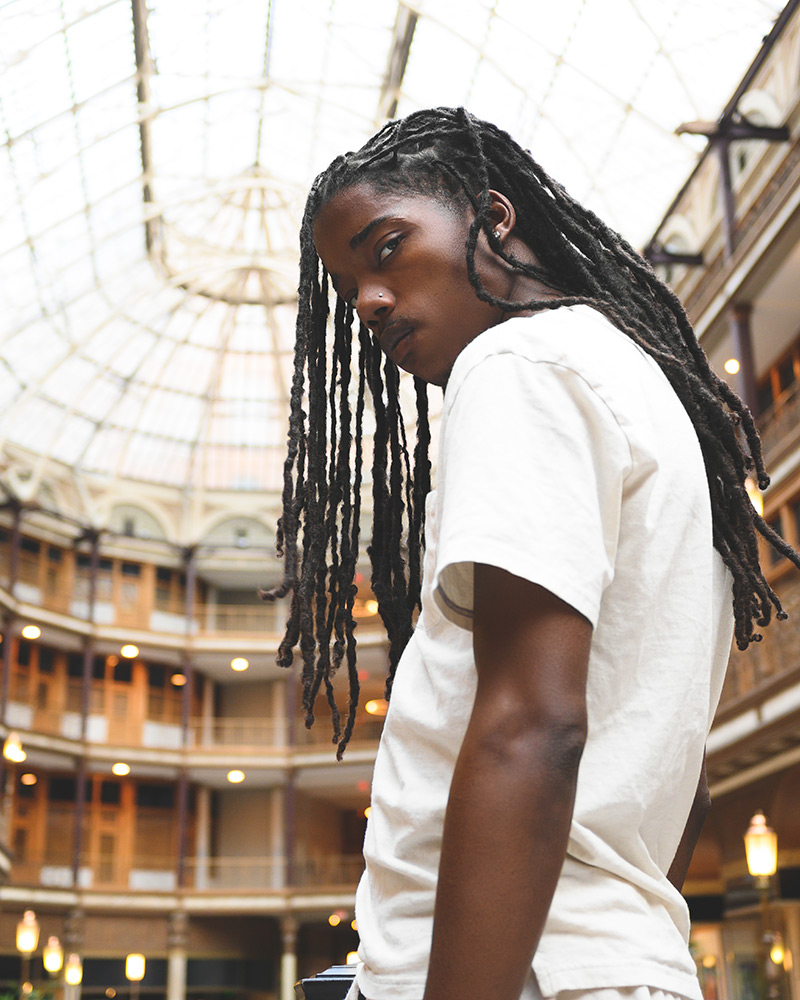 Bobby Kenny III photo of a guy looking at the camera with long dreadlocks