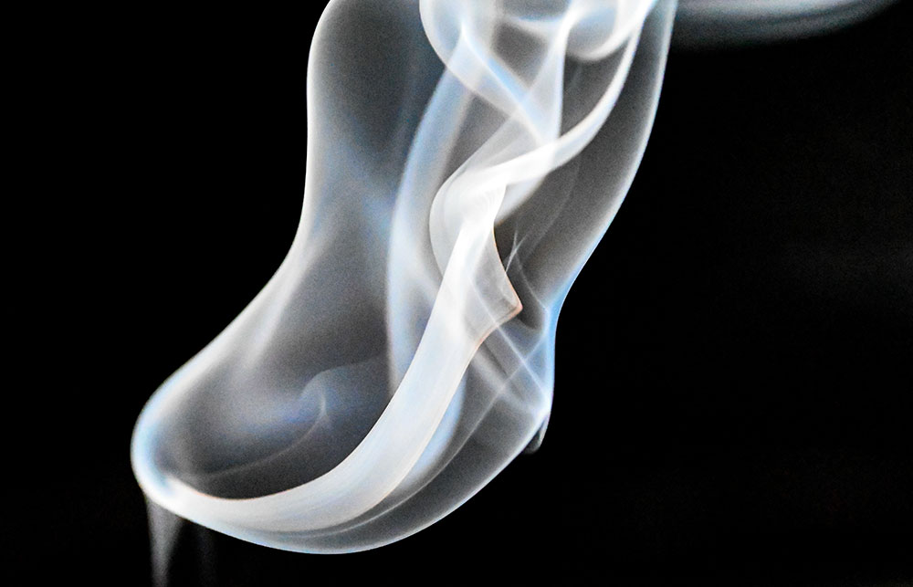 Jasmin Javon macro abstract photo of white smoke on a black background