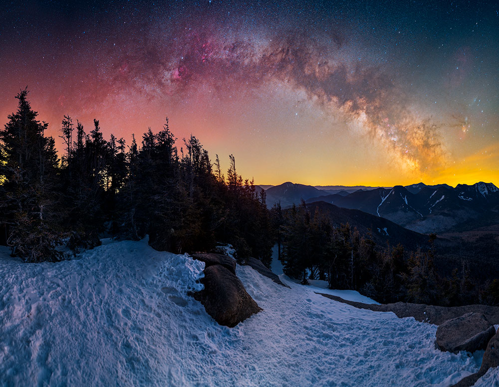Dan Stein photo of the Milky Way in the sky over a snow covered landscape