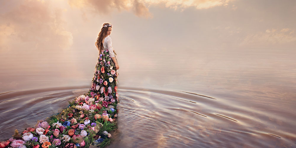 D'Ann Boal photo of a girl with a dress made of flowers in water