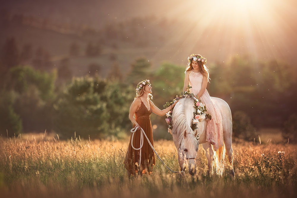 D'Ann Boal photo of a mom with her daughter on a horse in a valley