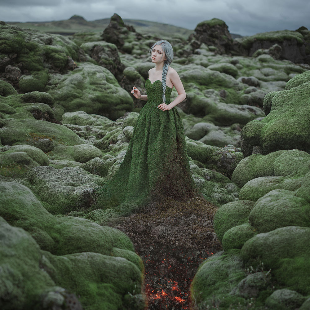 Anya Anti photo of a girl in a dress made of moss, among mossy rocks symbolizing deforestation