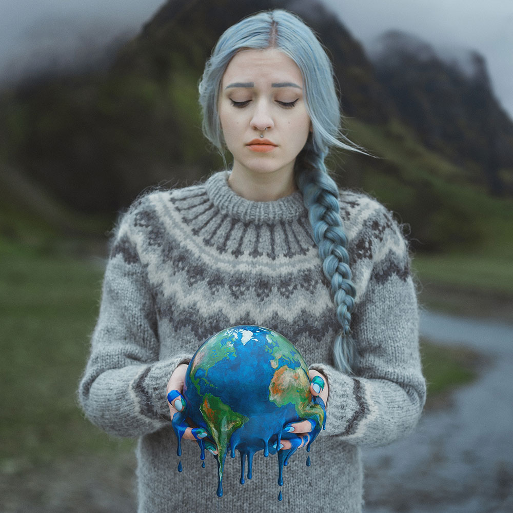 Anya Anti photo of a girl with a melting globe of earth in her hands, symbolizing global warming