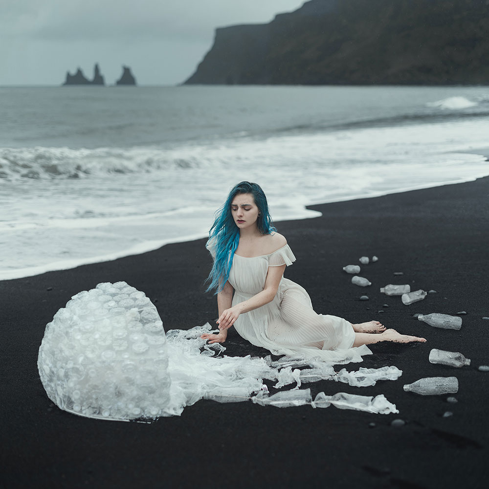 Anya Anti photo symbolizing plastic pollution showing a girl on a beach with a jellyfish made of plastics