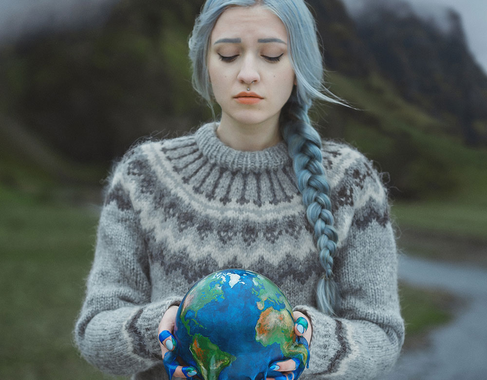 Anya Anti image of a girl holding a melting earth symbolizing global warming