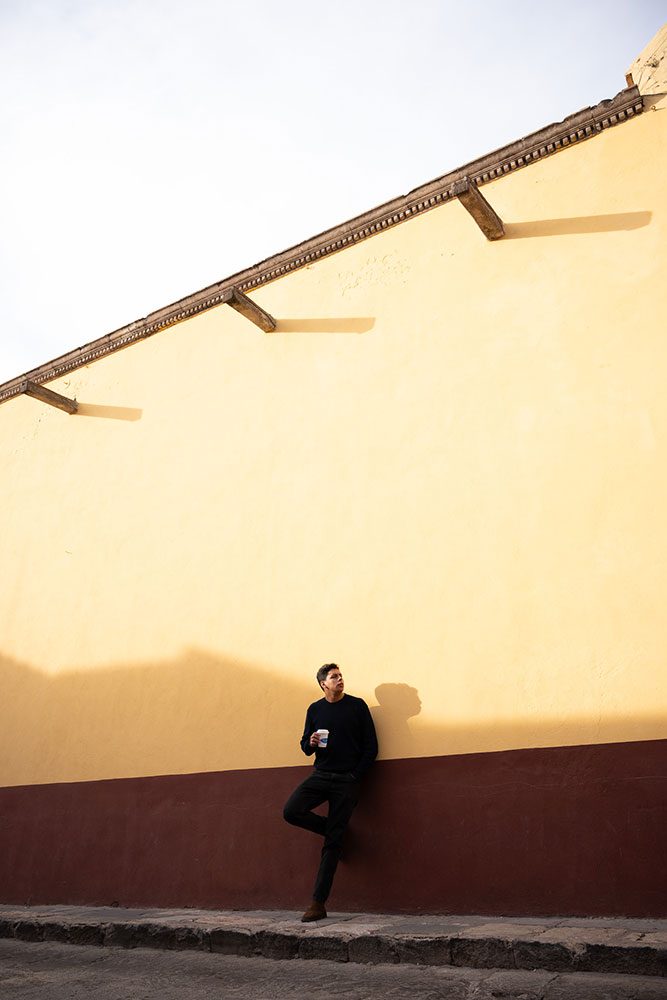 Arturo Carillo photo of a model against a red and yellow building