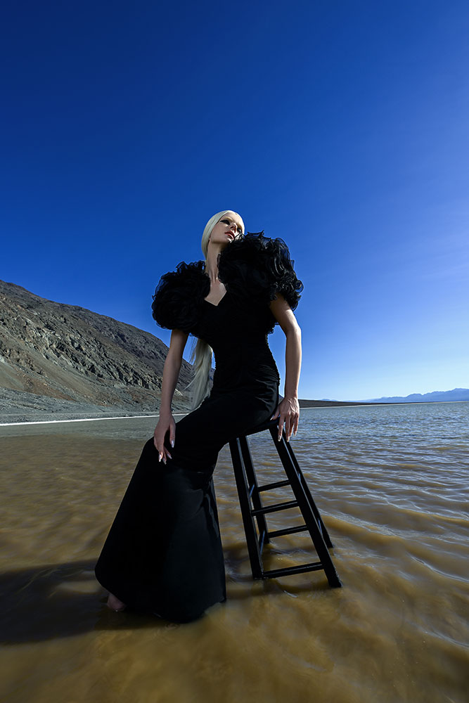 Joyce Charat photo of a model in a black gown sitting on a stool in the water, taken with the Z6III