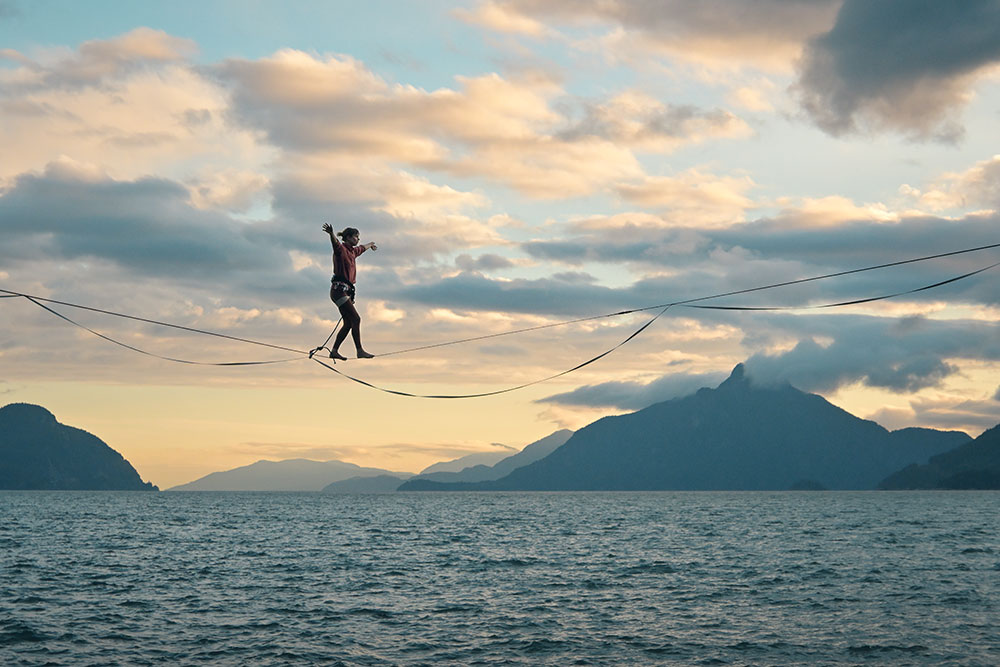 Ian Harland photo of a climber on a line over water